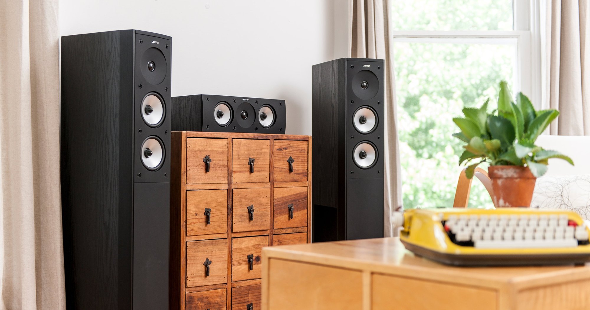 Floor-standing speakers in a living room