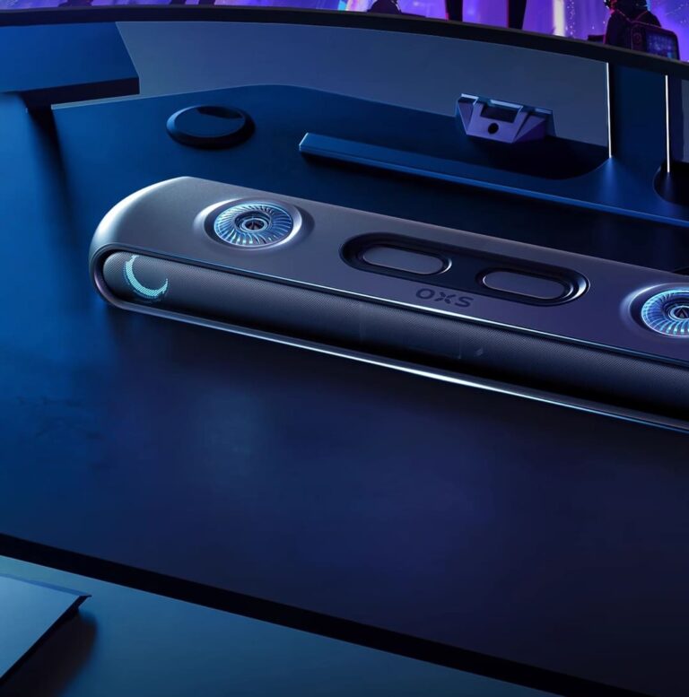 OXS Thunder soundbar with RGB accent lighting on a dark desk in front of a monitor